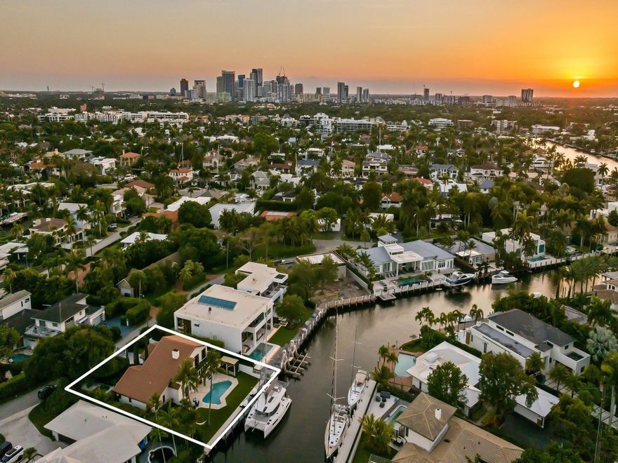Gated waterfront estate on high ground, fully renovated with luxury finishes. Located in the desirable Seven Isles neighborhood of Las Olas isles. This 2-story home features soaring ceilings, open living spaces, 2 fireplaces, and a designer kitchen. Recent updates include new floors, windows, doors, kitchen, and baths. Resort-style outdoor living with saltwater pool, summer kitchen, hot tub, dual grills, firepit, new 85' seawall, and powered composite dock with separate meter. Mature landscaping with low-maintenance Astroturf. Natural gas generator.