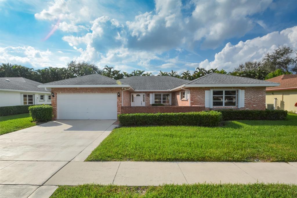 Located on a private lot that backs to a golf course, this home is meticulously maintained. Large kitchen has granite counter tops, tumble marble backsplash, pull outs in kitchen cabinets, stainless steel appliances including an infrared convection oven, new microwave and special overhead kitchen lighting. Master Suite easily fits a king size bed and has 2 walk-in closets. Vanity in Master Bath has granite counter. Guest Bath has been renovated with new shower area and vanity. Ceramic tile flooring except in bedrooms that have beautiful laminate flooring. Front Courtyard/Patio is tiled. Large backyard has patio that is perfect for relaxing or entertaining. Community has low HOA and offers a heated pool, tennis court, bocce and clubhouse. Beautiful Home!