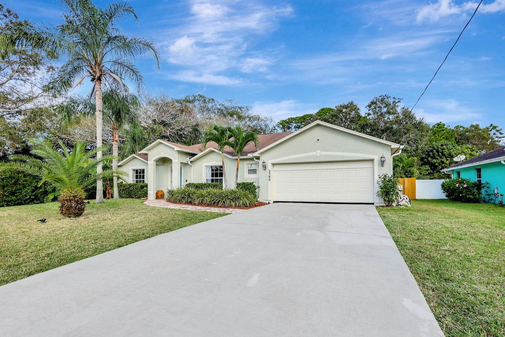 Photo of 2389 SE Gillette Avenue, Port Saint Lucie, FL 34952 (MLS # R11046209)