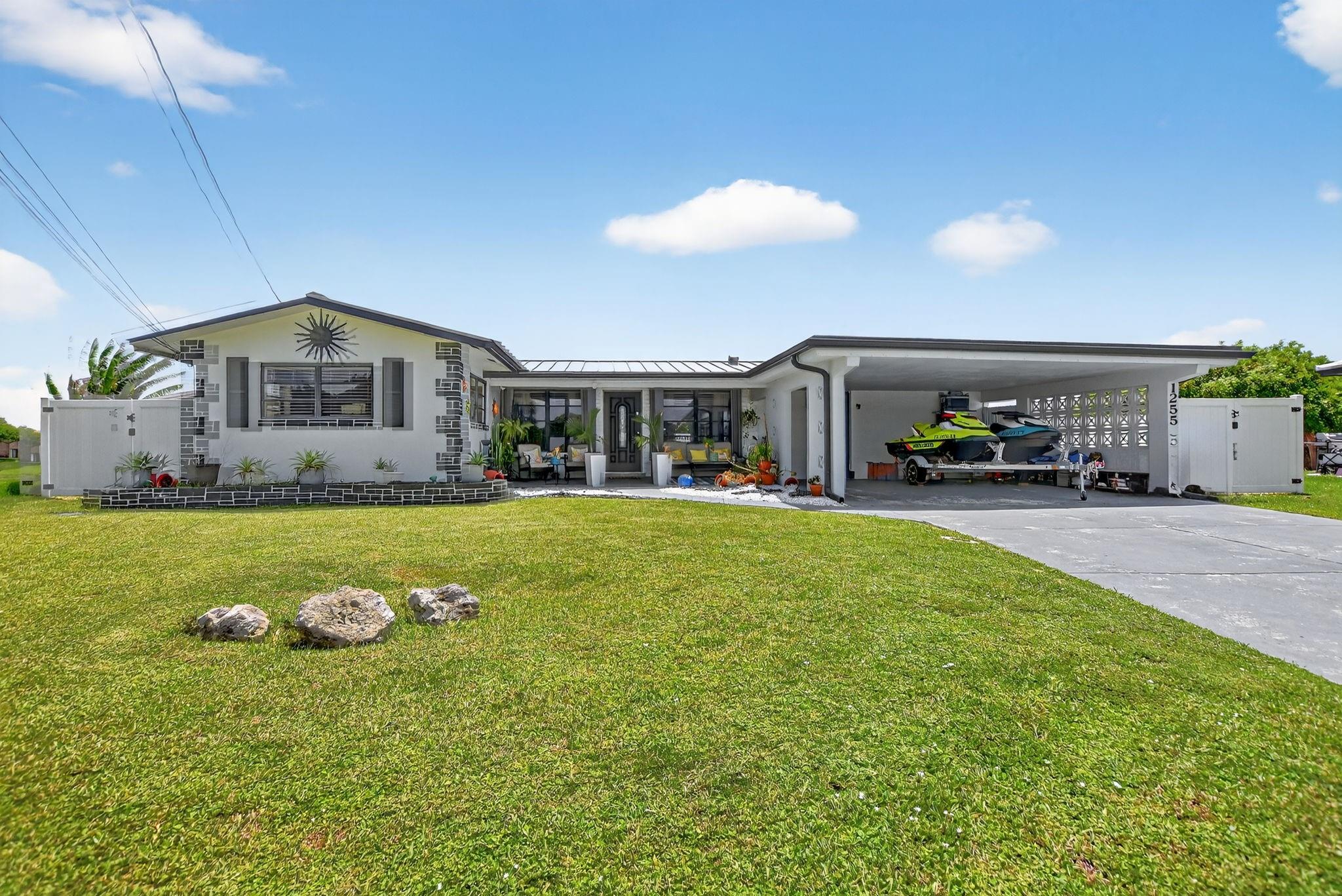 Welcome home to this perfectly situated 3 bedroom, 3 bath lake front, entertainers dream! Located on a secluded cul-de-sac, pie shaped lot with wide sprawling waterfront views. This home is highlighted with a massive open concept kitchen/living room area ideal for hosting guests that seamlessly transitions into an expansive backyard with a private pool, tiki-hut, dock, covered grill area with decking and private bar. The tastefully designed kitchen features granite countertops, all wood cabinets and walk in pantry/utility room. Detached structure and shed offer maximum storage. Large master bedroom with on suite bathroom and split floor plan. Additionally, newer metal roof installed 2021, HVAC 2019, and tankless water heater 2020. Schedule your showing today!