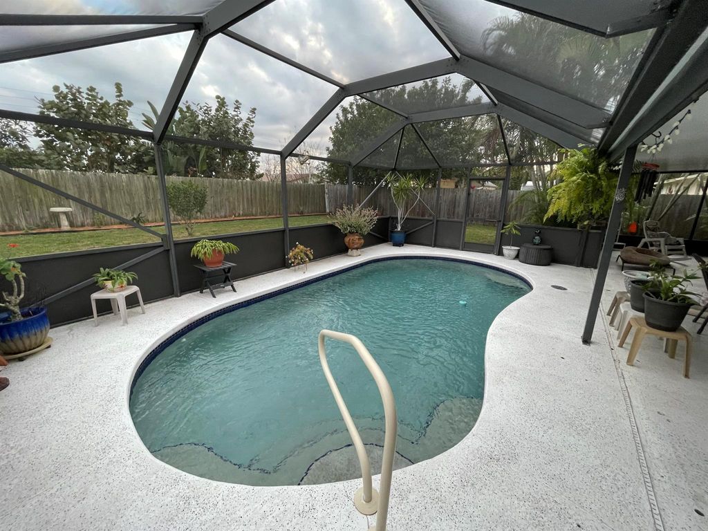 Photo of 308 NE Camelot Drive, Port Saint Lucie, FL 34983 (MLS # R10960619)