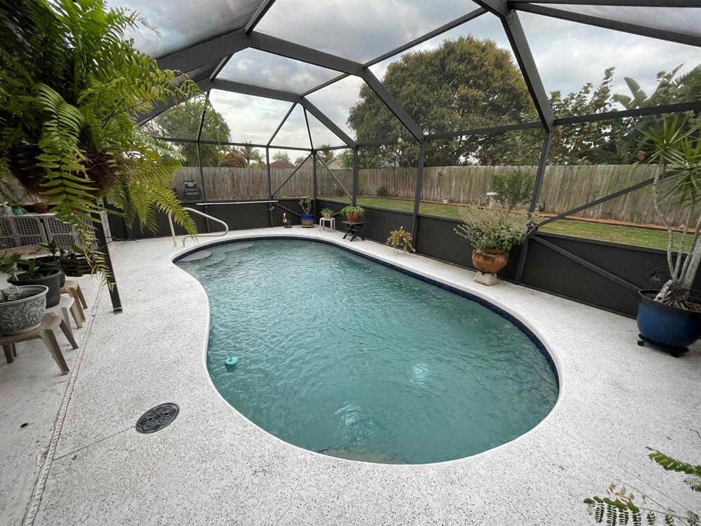 Photo of 308 NE Camelot Drive, Port Saint Lucie, FL 34983 (MLS # R10960619)