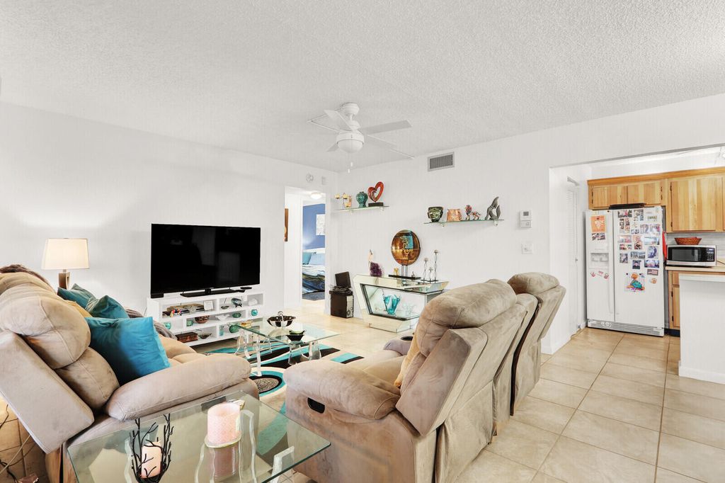 Photo of 309 Knotty Pine Circle #A-1, Greenacres, FL 33463 (MLS # R11166850)
