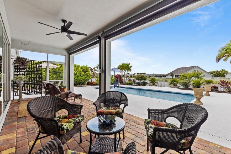 Too many upgrades to mention! Luxury meets lifestyle in this 3 bedroom / 2 bath POOL HOME with water view in Tradition's gated Heron Preserve! Heated/cooled pool with spa bench, dual arch fountains, and landscaping create a private oasis. Chef's kitchen offers 42'' cabinets, quartz counters, backsplash, and upgraded appliances. Owner's suite includes granite vanity, frameless shower, custom walk-in closets! Interior features diagonally laid flooring, coded door lock, smart-home tech, security camera wiring, Lennox AC, and app-enabled garage door. Extended garage with plumbing, plus laundry utility sink, whole-house water softener, and storage. Community provides gated security, pool and a clubhouse. Minutes to beaches, Cleveland Clinic, world class shopping, and dining!