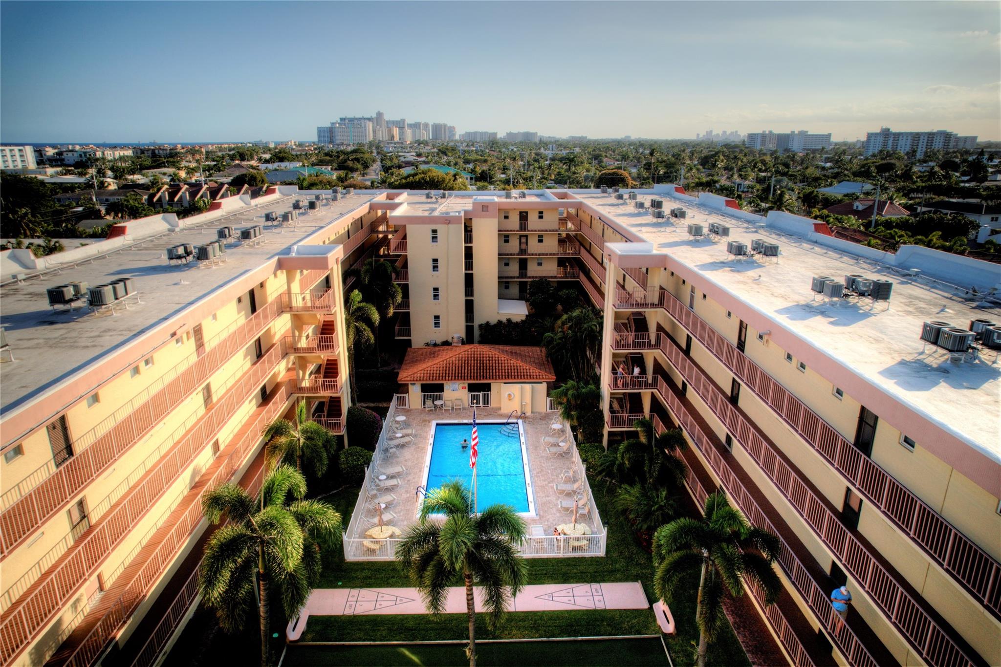 Condo living at its best in the heart of Lauderdale by the Sea! This spacious 2 bed/2 bath unit offers nearly 1,200 sf, a large east-facing entry with a courtyard and pool peek, and a split-bedroom layout with 2 ensuite baths and ample closets. Features include impact windows and doors, an eat-in kitchen with passthrough, and assigned covered parking. Poinciana by the Sea is a well-maintained complex with tropical landscaping, a heated pool, cabana with BBQs, and bocce/shuffleboard courts. Low HOA fees with reserves. A quick walk to Publix, pristine beaches, snorkeling, shops, and the vibrant and quaint downtown of Lauderdale By The Sea. Make This YOUR Paradise!