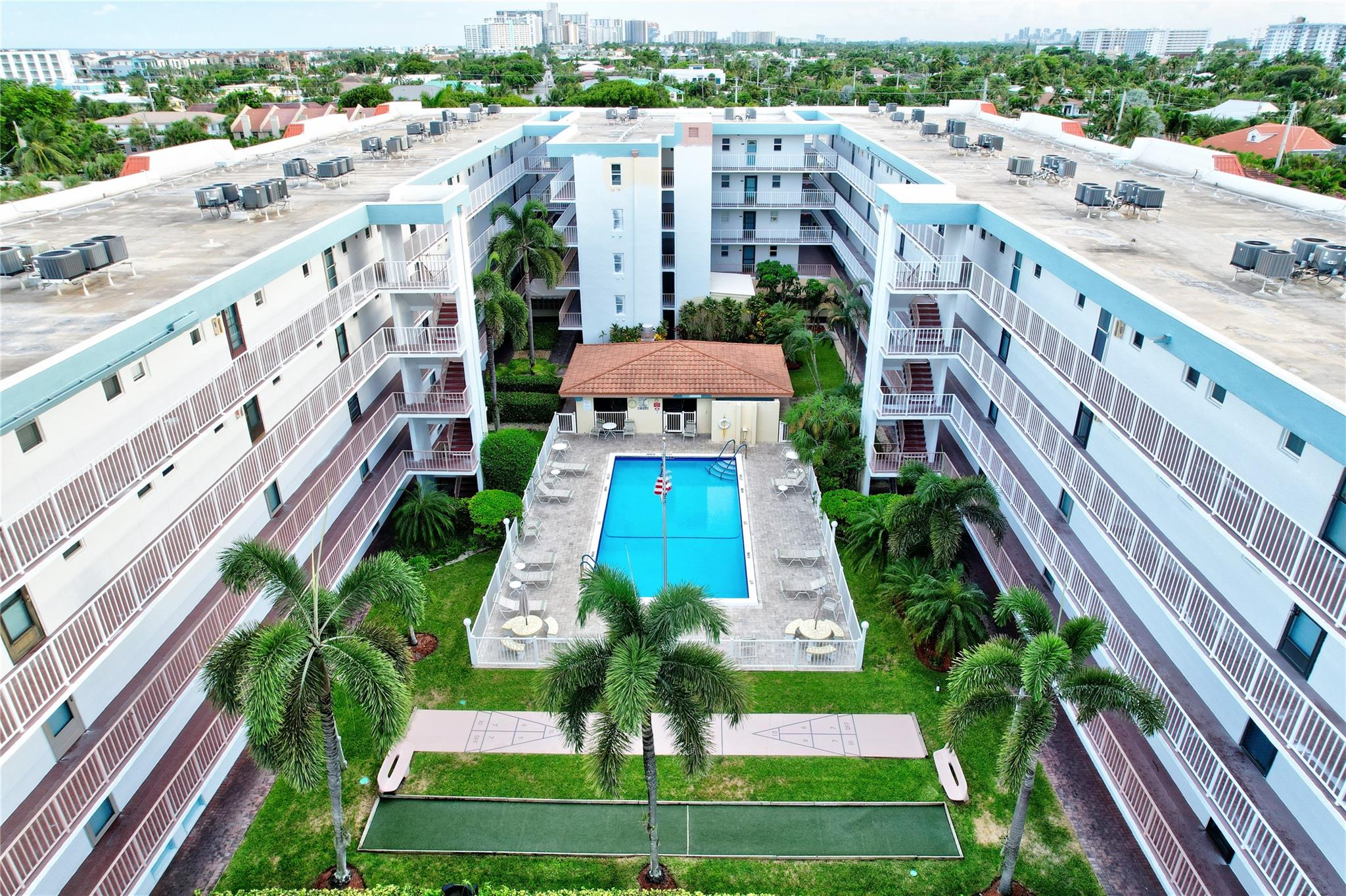 Condo living at its best in the heart of Lauderdale by the Sea! This spacious 2 bed/2 bath unit offers nearly 1,200 sf, a large east-facing entry with a courtyard and pool peek, and a split-bedroom layout with 2 ensuite baths and ample closets. Features include impact windows and doors, an eat-in kitchen with passthrough, and assigned covered parking. Poinciana by the Sea is a well-maintained complex with tropical landscaping, a heated pool, cabana with BBQs, and bocce/shuffleboard courts. Low HOA fees with reserves. A quick walk to Publix, pristine beaches, snorkeling, shops, and the vibrant and quaint downtown of Lauderdale By The Sea. Make This YOUR Paradise!