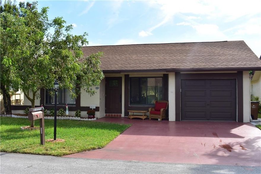 ***BACK ON MARKET - HOME APPRAISED WELL OVER ASKING PRICE - OWNER MOTIVATED **WELL APPOINTED KITCHEN RIGHT OFF THE GARAGE WITH EAT IN AREA & OVERSIZED PASS THRU TO DINING AREA, CATHEDRAL VOLUME CEILINGS IN LIVING & DINING AREA, SPLIT BEDROOM FLOOR PLAN, TILE THROUGHOUT & WOOD FLOORS IN BEDROOMS, UPGRADED BATHS & BEAUTIFUL MASTER BATHROOM SHOWER WITH MOSAIC GLASS WALLS AND UPGRADED SHOWER HARDWARE.  OTHER FEATURES INCLUDE IMPACT GLASS & HURRICANE PROOF UPGRADED FRONT DOOR AND GARAGE DOOR.  EXTERIOR BACK BOASTS IMPACT GLASS SLIDER, & NEW POURED CONCRETE AREA PERFECT FOR BBQ AND SMALL TABLE & CHAIRS!  ALL WINDOWS AND SLIDERS HAVE NEW SCREENS. ALSO, NEW APPLIANCES, 3 TON AC, DOUBLE DRIVEWAY & LOW QUARTERLY MAINTENANCE!