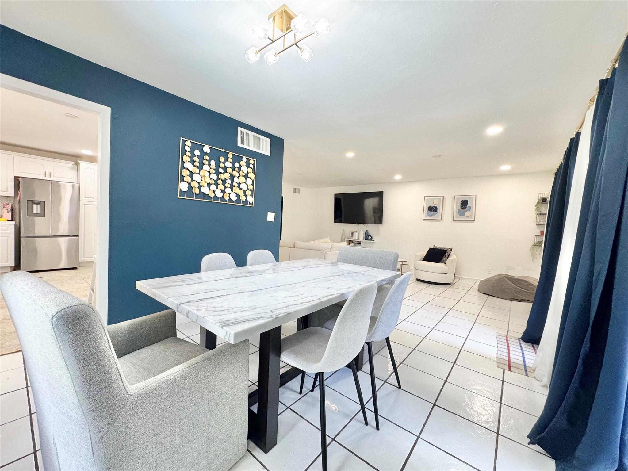 Nestled in a serene, guard-gated community, this 4-bedroom, 3-bathroom tri-level home offers peaceful views from the dining and living areas. The eat-in kitchen is perfect for casual meals, and the convenience of an in-unit washer and dryer adds to the home's appeal. Residents enjoy comprehensive HOA coverage, including common area upkeep, security, landscaping, and access to three pools and jogging paths. The Hills of Inverrary is renowned for its well-maintained surroundings and active lifestyle amenities.