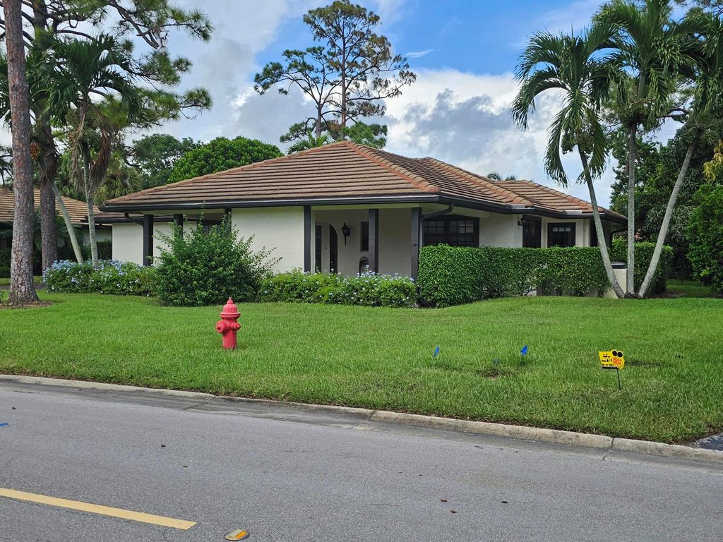 Photo of 435 Pine Villa Drive, Atlantis, FL 33462 (MLS # R10924619)