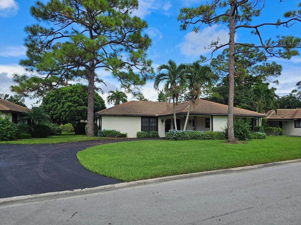 Photo of 435 Pine Villa Drive, Atlantis, FL 33462 (MLS # R10924619)