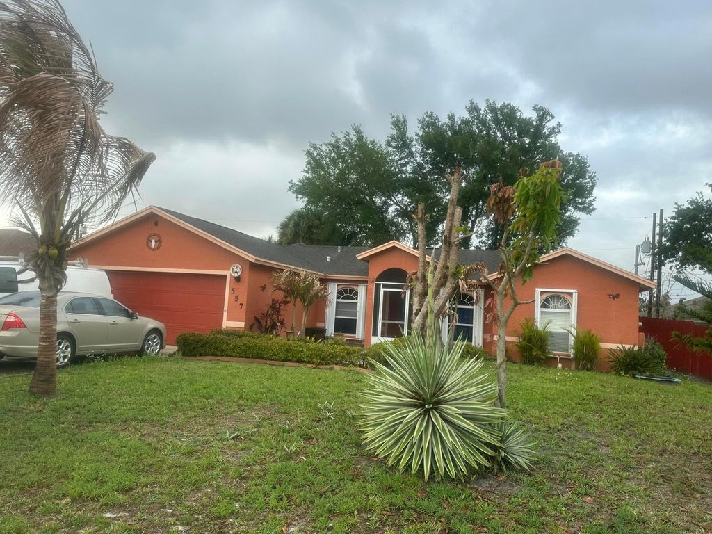 Photo of 557 SW Baoy Avenue, Port Saint Lucie, FL 34953 (MLS # B26018029)