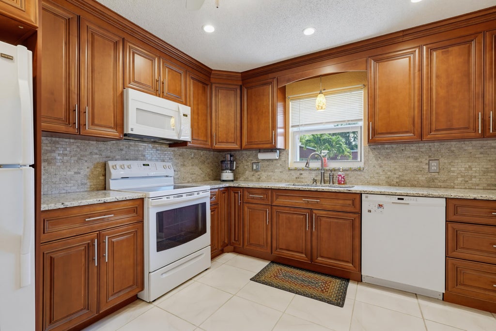 Photo of 676 Laconia Circle #B, Lake Worth, FL 33467 (MLS # B26052712)