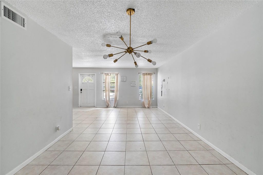 Photo of 3920 Woodside Drive #12-A, Coral Springs, FL 33065 (MLS # F10398839)