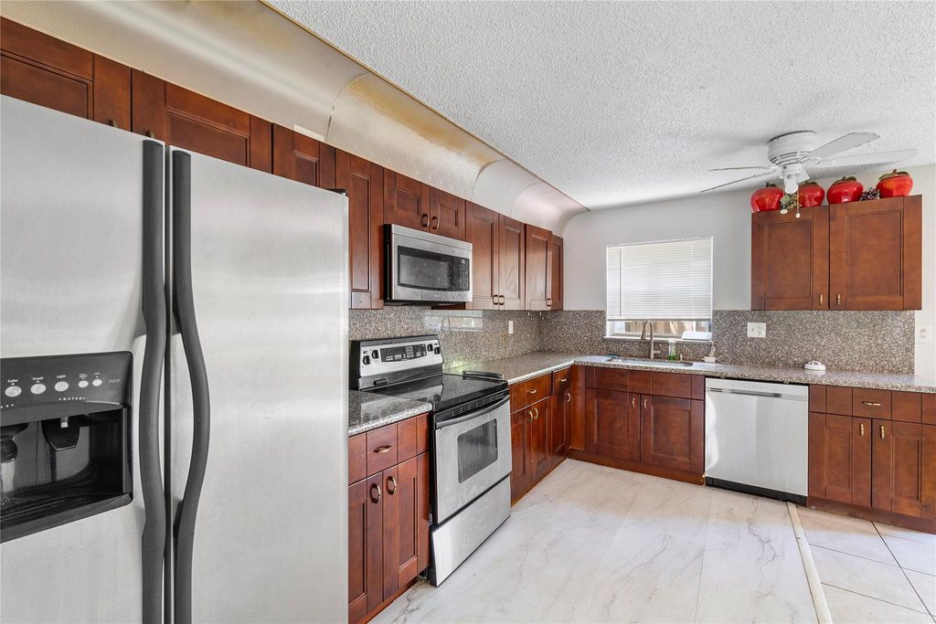 Photo of 3920 Woodside Drive #12-A, Coral Springs, FL 33065 (MLS # F10398839)