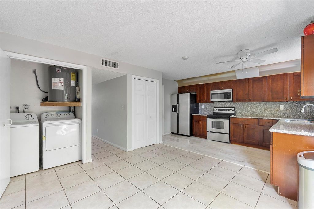 Photo of 3920 Woodside Drive #12-A, Coral Springs, FL 33065 (MLS # F10398839)