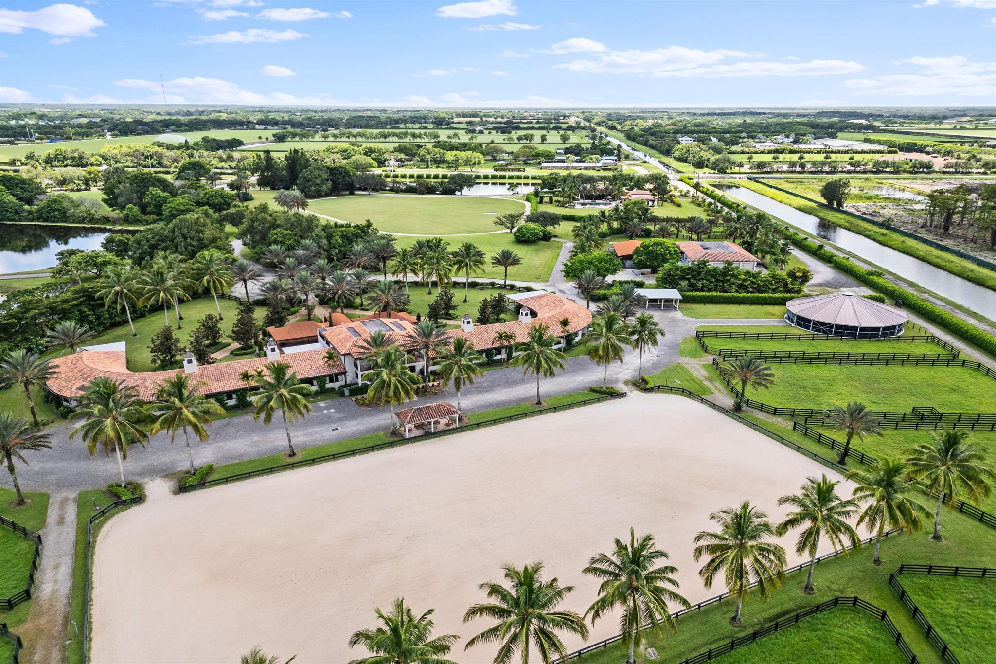 Up to 36 Stalls available for rent during 2024-25 Season. 20 acre equestrian estate in a prime location! Directly on bridle path, less than 1 mile walk to Wellington International show grounds. This Farm is fully gated and has 2 barns, beautiful lounges, office space, living quarters , and kitchen & dining areas. The main barn with two wings of 10 stalls each, tack room & storage room for each side, rubber pavers aisleways, laundry room with 2 washers/dryers to accommodate horse and staff laundry & separate storage room. In addition to the main barn, an annex barn with 12 stalls plus 4 stalls by the maintenance building, for a total of 36 stalls on site. Brand new 150' x 250' Wordley Martin arena , 15 oversized grass paddocks, and a oversized Derby field with sand riding track
