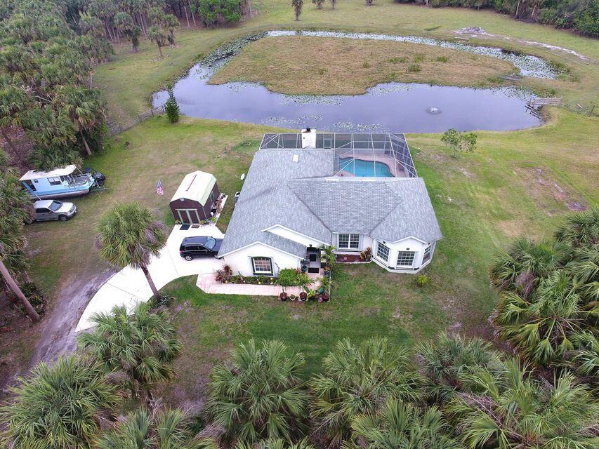 16 +/- Acres in this Beautiful Ranchette off Carlton Road that has a long private road that leads you to a home and split into 2 parcels. The house is on 4.91 Acres with a house and pool and part of the pond is Homesteaded, and 11.24 Acres surrounds the almost 5 Acres and is AG exempted and has cattle on this part of the property. The house has 3 Bedroom, 2 Bath, 2 Car Garage CBS home with a screened in pool. Enjoy country living at its best and away from the city limits. This home has a split plan with 2000 sq feet under air and is clean with Tile floors throughout the house. Formal living and dining and a Large Family room with a working wood burning fireplace just off the Kitchen. This home is perfect for entertaining.This home is perfect for entertaining. Kitchen has Granite Count