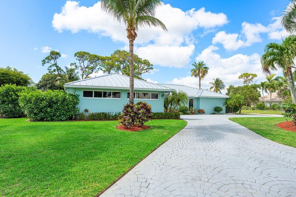 Photo of 474 S Country Club Drive, Atlantis, FL 33462 (MLS # R11089361)