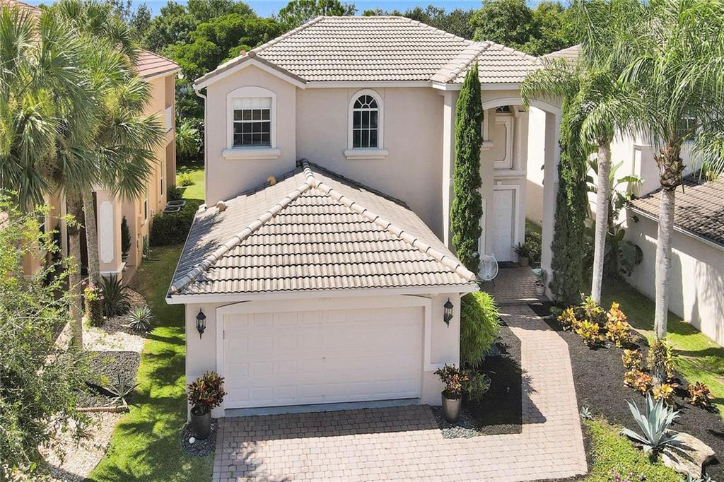 Priced to sell, Look no further, This One of a kind home in Isola Bella just became available. Professionally decorated by a known decorator and with top dollar finishes. This 5 bedrooms 3.5 bathroom, 2900 square foot home features 3 inch Quartz granite countertops with a kitchen island, Custom Bathrooms ,24 inch porcelain tile, electric roll down shades, Custom draperies, custom built in closets, Brazilian cherry wood floors, recessed lighting, built in ceiling surround sound speakers with the master bedroom down stairs and 4 bedrooms and a loft area upstairs. This home is suited to impress the most upscale buyer, Must see!!! Gated and All amenities clubhouse.