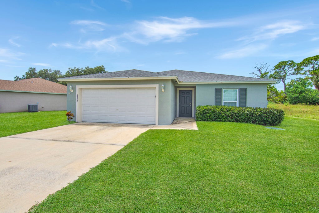 Photo of 718 NE Perch Lane, Port Saint Lucie, FL 34983 (MLS # B26075185)