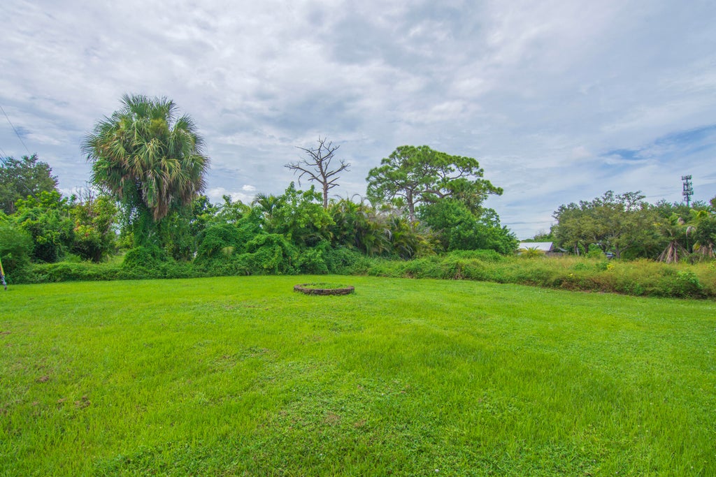 Photo of 718 NE Perch Lane, Port Saint Lucie, FL 34983 (MLS # B26075185)