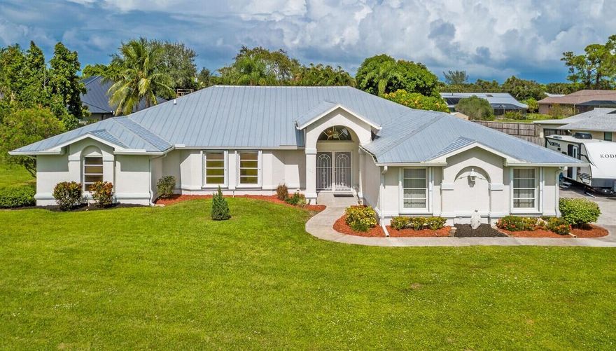 Sandpiper Bay- Home of the Saints Golf Club & St. Lucie Botanical Gardens. NO HOA FEES! Well-maintained CONCRETE BLOCK HOME   with 2,600 sq. ft. under A/C, Sunny , bright & happy. 2019 Metal Roof, Accordion shutters Etc. This impressive residence features 4 bedrooms, enormous country kitchen that boasts granite countertops and new appliances ,formal dining room, family room w/ pool view and a spacious living room.Set on over half an acre of beautifully landscaped land, this home features a full-length covered lanai overlooking a recently resurfaced pool with spa, measuring 37 feet by 19 feet.  Boat/Truck/RV parking OK . Enjoy the tranquility of this community, which has only one road in and out, conveniently located near beaches, shopping, hospitals, top-notch schools & Treasure Coast Mal
