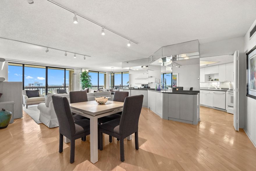 Located high above the city on the 19th floor, this very private and quiet corner residence offering an elevated living experience with sweeping perspectives and an abundance of natural light. Thoughtfully designed, the home features 3 bedrooms and 2.5 baths, complemented by an elegant layout that welcomes you with a gracious foyer and flows seamlessly into expansive dining and living areas—ideal for both relaxed everyday living and entertaining. The kitchen is both stylish and functional, showcasing a clean white design with plenty of storage, appliances, and an adjacent laundry room outfitted with new Electrolux machines. Generous cabinetry and well-planned workspace make it as practical as it is inviting, perfectly positioned to serve the main living spaces while maintaining a sense of openness and connection throughout the home.  Every detail of this residence reflects comfort and sophistication, from its spacious proportions to its serene, tucked-away corner positioning. The combination of privacy, thoughtful layout, and high-floor vantage point creates a rare opportunity to enjoy refined condo living in one of West Palm Beach's most desirable settings.