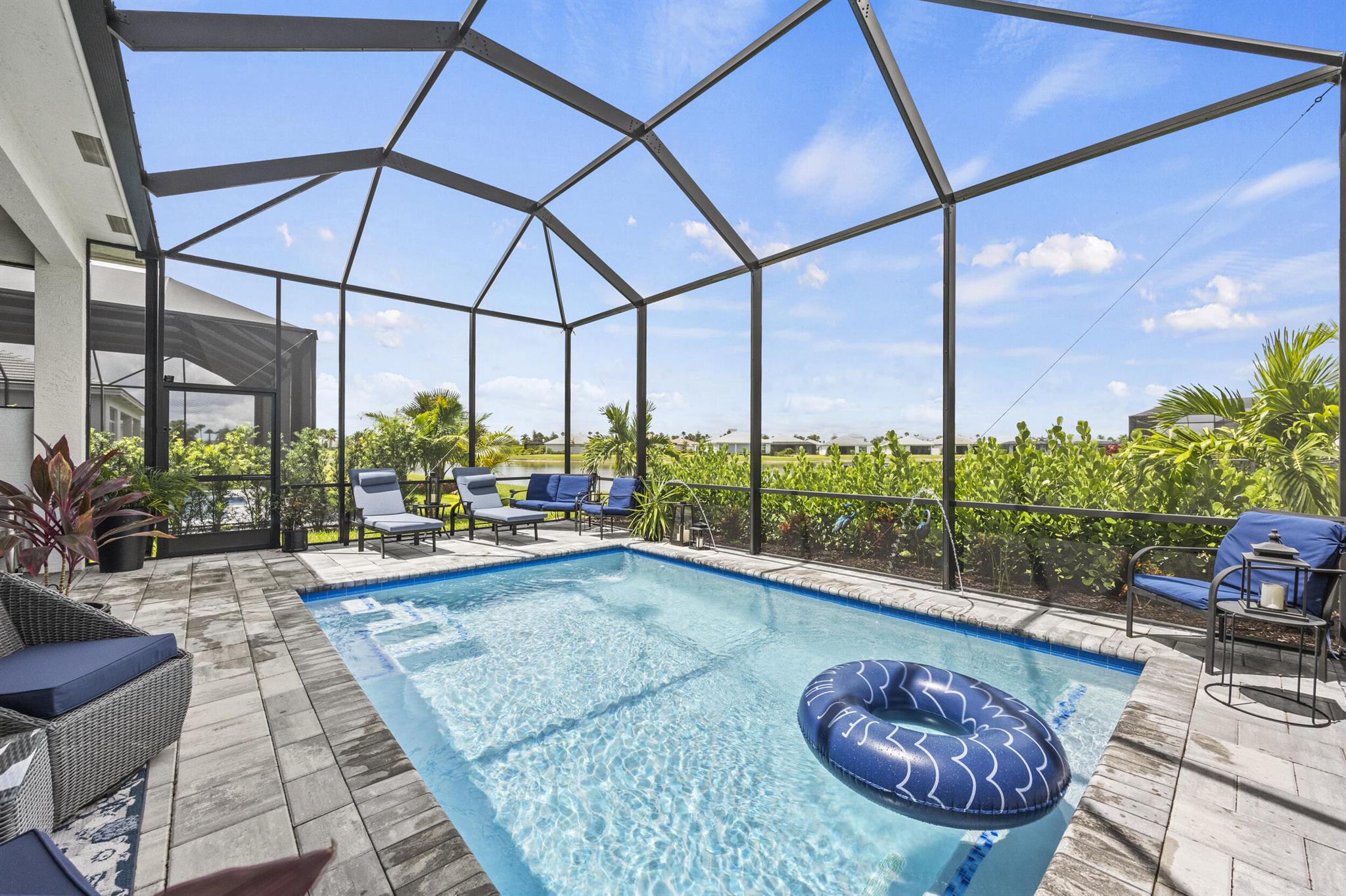 Welcome to this charming 3-bed, 2-bath Caroline floorplan home in desirable PGA Verano! This brand new construction built in 2024 is 1,787 sq ft of living space with concrete block construction for exceptional durability & hurricane impact windows & doors for maximum safety - Florida-specific advantages that also help keep insurance rates low. The primary bedroom offers a peaceful retreat, while two additional bedrooms provide flexibility for family or guests. You'll love the sparkling pool - perfect for Florida living & entertaining year-round. The neighborhood boasts excellent amenities, incl the prestigious PGA Golf Club featuring 54 holes of championship golf, and convenient shopping at Publix just outside the gate. Nearby, Cleveland Clinic Tradition Hospital provides peace of mind.