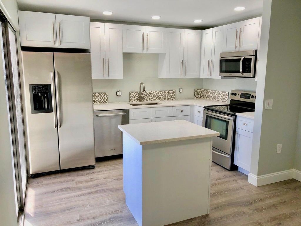 Photo of 3193 Meridian Way #B, Palm Beach Gardens, FL 33410 (MLS # R10957198)