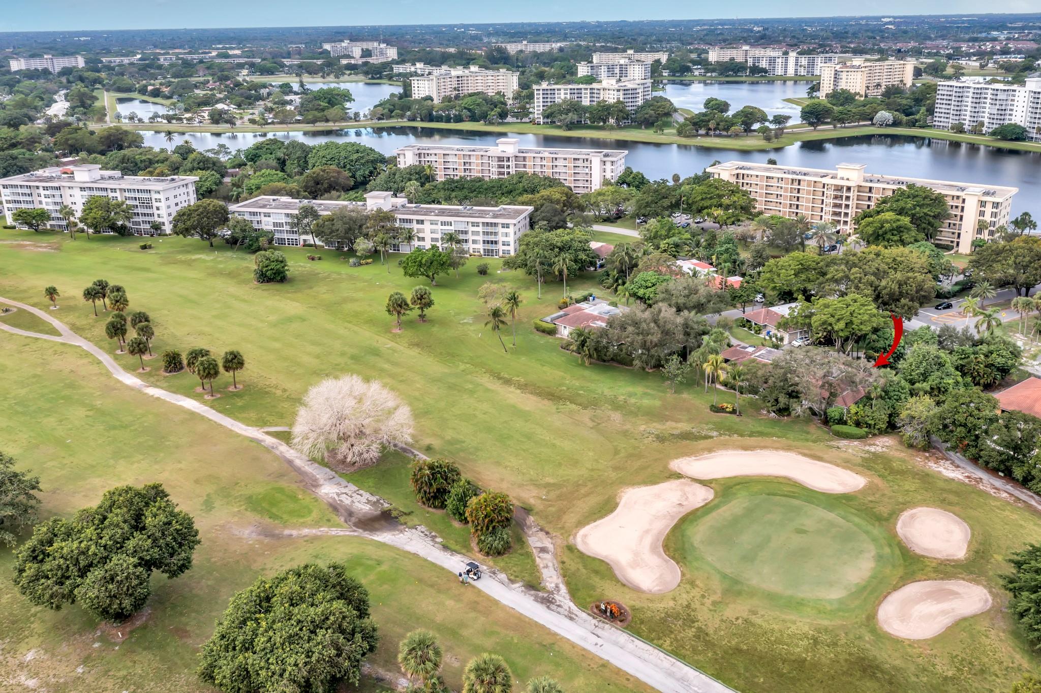 Spacious 3 bedroom 3 bathroom villa with open floor plan on the green of Palm Aire golf course this unit offers a screened in patio, 3 parking spots a spacious master bedroom with large walk-in closet, sunken tub with separate large walk-in shower and much more Hurricane accordian shutters a/c from 2019, newer water heater and washer dryer.