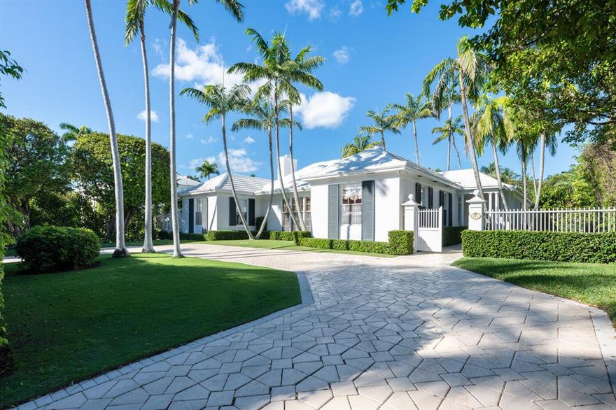 Opportunity knocks! 1951 Wyeth single story Bermuda on 23,958 sq ft. Tucked between the ocean & intracoastal, this 5 BR/5 full BA + den & office is perfectly sited on a private, lushly landscaped, walled in 100 x 239 lot with rear service entrance on Vita Serena w/ 2 car oversized garage. 5,276 total sq ft with bright interiors, wood floors, high ceilings and wonderful room scale. Welcoming front circular driveway & covered side entry open to wide front hall. Pecky cypress paneled living room with raised ceiling, fireplace, bowed window, built ins & pocket screens/doors open to loggia with floor to ceiling glass walls & doors. Large formal dining room with oversized paned windows adjacent to loggia also has screened pocket doors. Primary bedroom with 2 walk-in closets & door out to pool has bath with dual sinks, jetted tub & separate shower. 2 large additional BRs in main wing have ample closet space and updated en-suite baths. Large butler's pantry and eat-in kitchen ready for updating has brand new 60" gas range & East facing patio perfect for grilling/morning coffee. Guest wing with 2 additional BRs/ 2 full BAs plus large office, den & laundry. Sun filled outdoor oasis is perfect for entertaining with grand heated pool, covered patio and deep expansive lawn. Steps to private deeded beach access and close to dining & shopping. List price will include town approved plans for expansion/renovation. Modernize this piece of Palm Beach history or build a new larger estate akin to the neighboring homes.