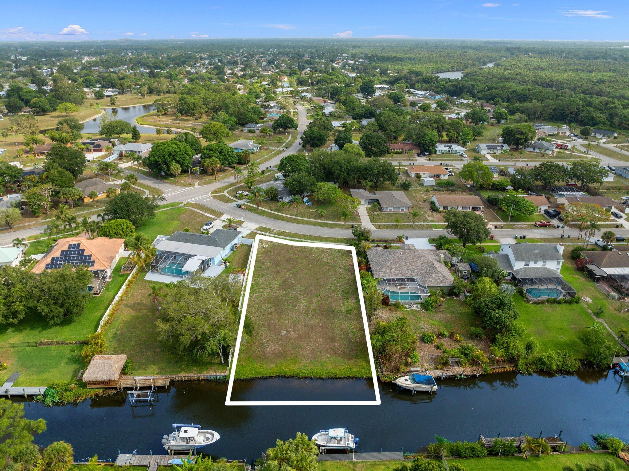 This is the PERFECT lot for your DREAM HOME! Experience the pinnacle of coastal living with this exceptional cleared vacant lot, perfectly situated on the water with easy ocean access. Nestled along the scenic St. Lucie River, this .33-acre property presents a unique opportunity to create your own waterfront paradise. Boaters will appreciate the seamless ocean access via the St. Lucie River, while everyone can enjoy the stunning water views. With no HOA restrictions, you have the liberty to design and build your dream home exactly as you envision it.