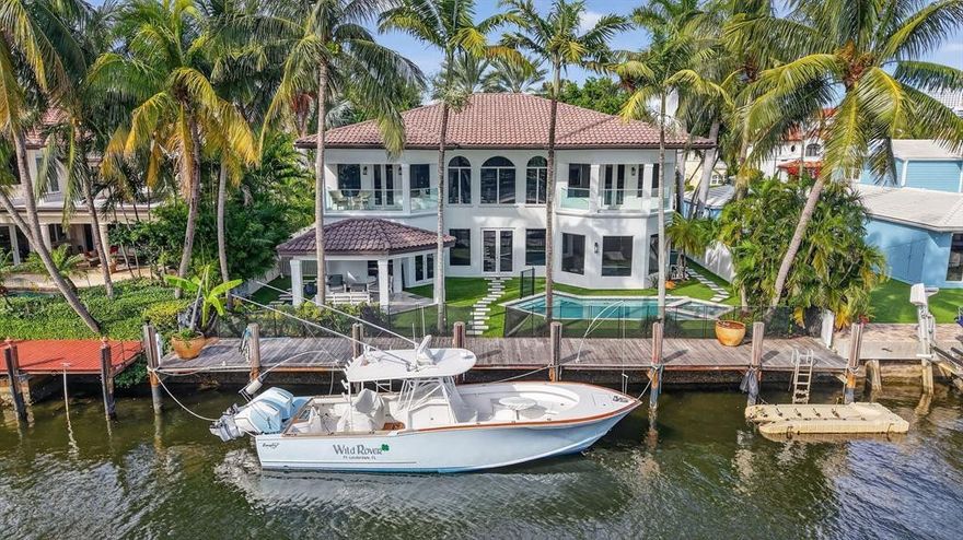 Newly Priced! Experience premier waterfront living in Seven Isles! Just 3 lots from the Intracoastal, this meticulously estate features 6 beds/ 7 baths, soaring floor-to-ceiling windows, large porcelain tile floors & private elevator. The elegant living area includes a fireplace & a newly remodeled gourmet kitchen with double islands, quartzite countertops, SS appliances & a gas cooktop. Perfect for indoor-outdoor living the backyard offers turf, a sparkling pool, outdoor bathroom, sauna, & a private deeded dock. Upstairs, rich wood flooring leads to the primary suite, private balcony, spa-style bath & a second oversized ensuite bedroom. With lush landscaping, a laundry room & numerous upgrades, this home offers resort-style living in one of Ft. Lauderdale's most desirable WF communities!
