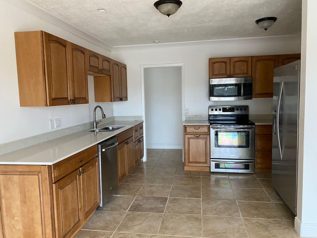 Photo of 18 Andros Road, Palm Springs, FL 33461 (MLS # B26045513)