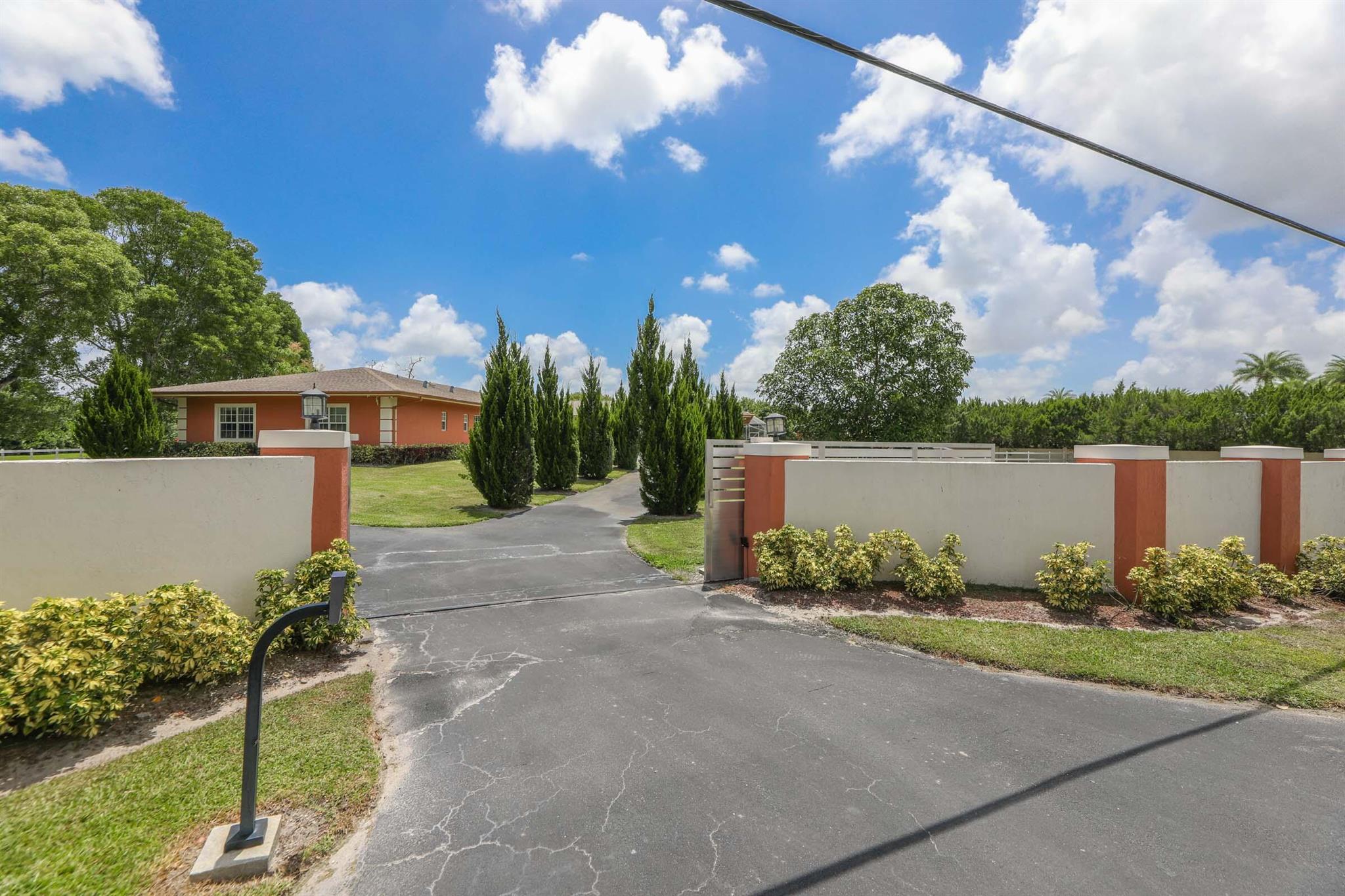 Welcome to your private Equestrian Paradise in Parkland! Nestled on nearly 5 pristine acres in the coveted BBB Ranches. This fully remodeled 2018 ranch-style estate is a rare opportunity to own a luxurious, equestrian-friendly retreat with no HOA and A+ rated schools. Enter through a private, automated gate to a long, sweeping driveway leading to a 2-car garage and a beautifully updated home with an open-concept layout filled with natural light. The main residence features 4 spacious bedrooms and 3.1 modern bathrooms, sleek porcelain tile flooring, and seamless indoor-outdoor living perfect for entertaining or relaxing.