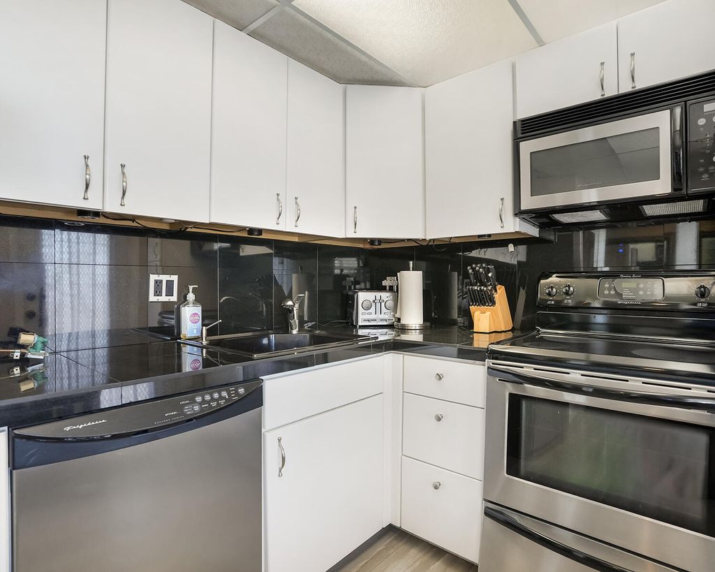 Photo of 2671 S Course Dr #907, Pompano Beach, FL 33069 (MLS # B26000776)