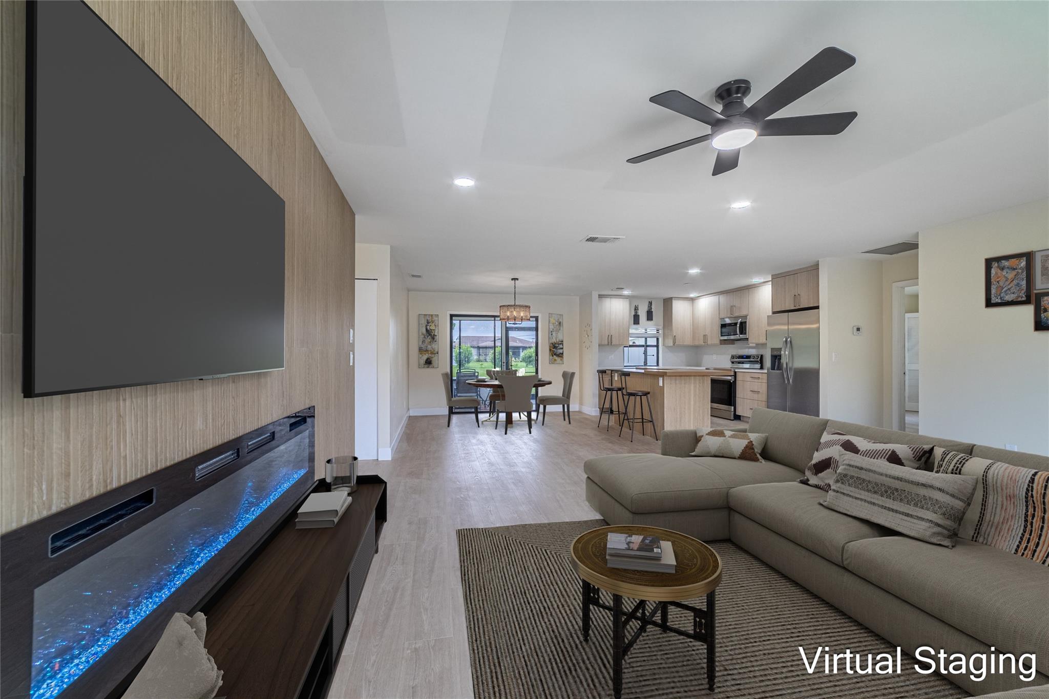 A beautifully reimagined 3-bedroom, 2-bath home in Port St. Lucie. This move-in-ready gem blends modern comfort with grounded, earthy charm on a spacious 0.25-acre lot with no HOA.
From the moment you enter, you’re welcomed by an open-concept layout filled with natural light, warm tones, and a calm, inviting energy. The home features luxury vinyl plank flooring throughout, recessed lighting, and a custom designer feature wall with a stylish electric fireplace.
The heart of the home is the brand-new kitchen—designed for both functionality and style. It boasts quartz countertops, quartz backsplash, soft-close cabinetry, and all new stainless steel appliances.