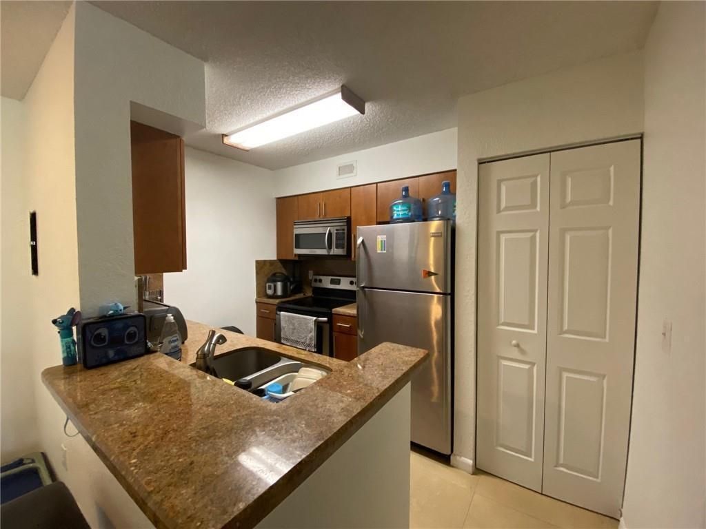 Photo of 2841 N Oakland Forest Drive #107, Oakland Park, FL 33309 (MLS # B26028116)
