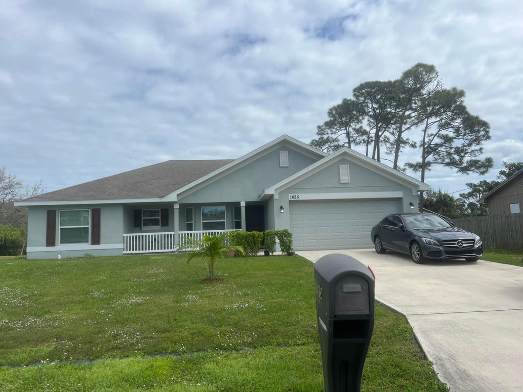 Photo of 1425 SE Navajo Lane, Port Saint Lucie, FL 34983 (MLS # R11066360)