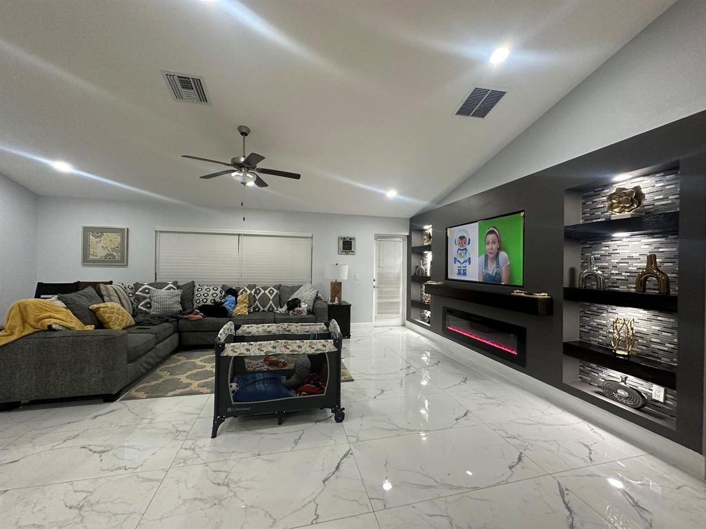 Photo of 1425 SE Navajo Lane, Port Saint Lucie, FL 34983 (MLS # R11066360)