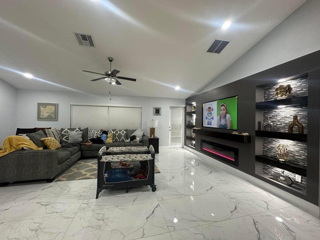 Photo of 1425 SE Navajo Lane, Port Saint Lucie, FL 34983 (MLS # R11066360)