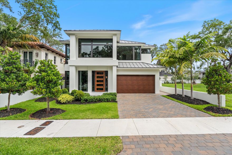 Built and ready to move in!!   Modern Transitional Masterpiece in the Heart of Colee Hammock. This thoughtfully designed home is complete and boasts oversized windows that flood the space with natural light, showcasing the lush, Old Florida vegetation and majestic oak trees. 5 bedrooms, 5.5 baths, an office/study, automatic generator, elevator, and a stunning wine cellar and bar, this home offers luxurious living at every turn. Enjoy the outdoors with a pool and a two-car garage, generator. Conveniently located near parks, shops, the beach, and the vibrant Las Olas Boulevard with its array of restaurants.