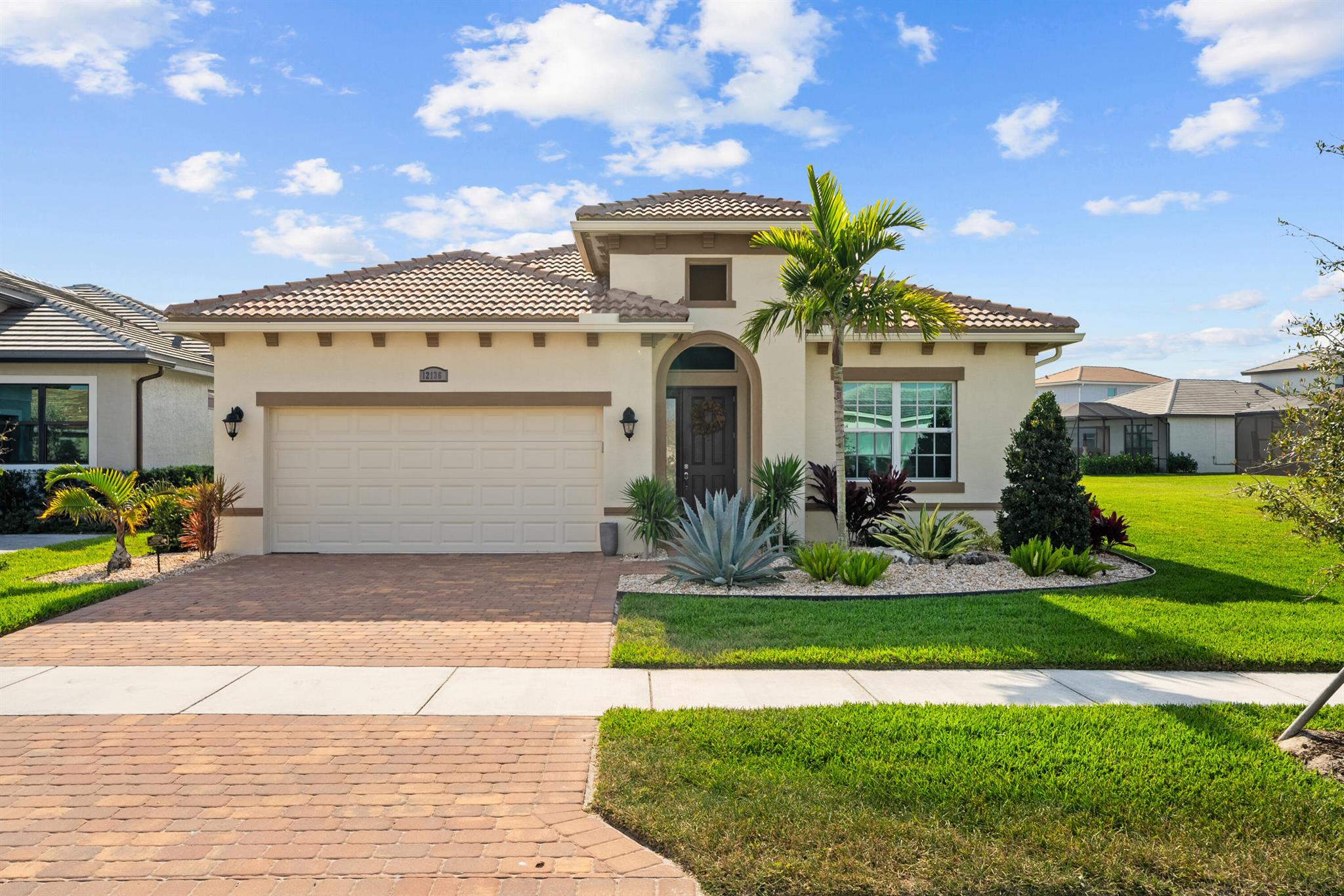 Gorgeous 3/2 Lago home in PGA Verano has an open floor plan with porcelain floors, wood closet space/linen closet & pantry, floor-to-ceiling tiled showers, large washer & dryer unit, wall oven, electric range, stainless steel hood. Home sits on a premium lake view lot & features a beautiful swimming pool with a tanning ledge inside the screen enclosure & travertine patio complete with a built-in summer kitchen. A fenced backyard provides additional space and privacy. Furniture & light fixtures from Restoration Hardware, 80-inch TV, Kef speaker system & upgraded high speed internet. This property is available for lease furnished or unfurnished. It includes essential household items such as linens, kitchenware & silverware. Located in the prestigious PGA VERANO.
