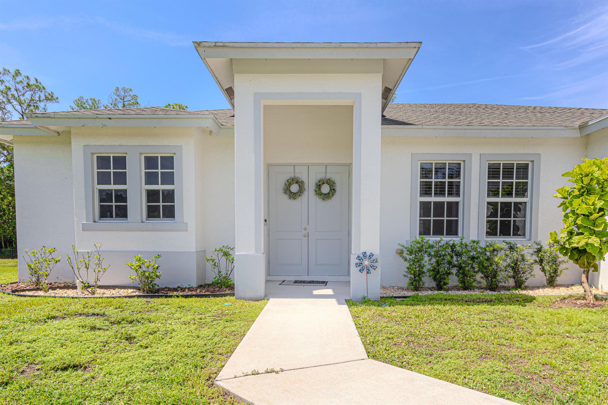 Stunning single family house located at a great and tranquil Loxahatchee area. This property features a 4 bedroom, 3 bathrooms and a 2 car garage with a very spacious floor plan, kitchen and living room. The house is sitting in a 1.17 acres, has all impact windows and doors, including the garage door; Well water is new with a complete reverse Osmosis Water filtration system. Take advantage of making this house your new home. Bring your boat, Rv and toys, there is plenty room for them and also plenty space for a pool. Enjoy Samuel Friedland Park, located just few blocks from the property.