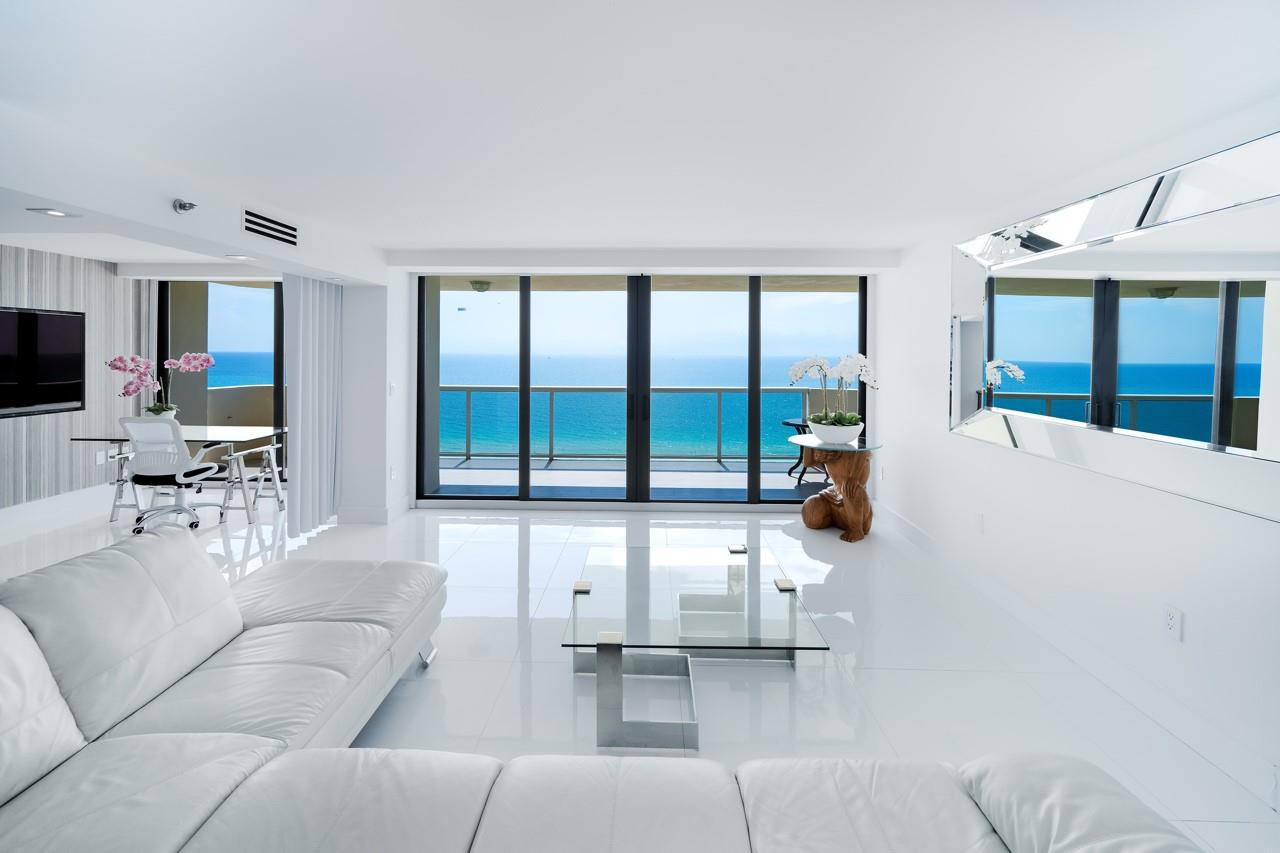 Spectacular Ocean, Intracoastal and Bay views from this gorgeous SE Corner Beauty w/ 3 Balconies and 1900 sqft! Completely re-done, the Elegant/ Neutral finishes compliment the panoramic ocean views. 3 Balconies Showcase the Panoramic Views. Full Bronze Impact Windows and Doors. Everything done to perfection! Formal Foyer, Custom Wine Cellar, Modern Recessed / Custom Lighting highlights the sparkling 36" Ceramic Floor. Gourmet Kitchen has every feature w/ lighting details that will delight you, Fabulous Coffee Bar, Grand Island w/ Waterfall Quartz, New GE Monogram Appliances! Huge ALL Custom Closets, Side by Side Washer/Dryer, Great Amenities, Beach Access, Lap Pool AND Recreational Pool / Spa, AWESOME Gym,
Complimentary Beach Service w/ 2 Chairs/Umbrella! 2 Deeded Garage Parking Spaces