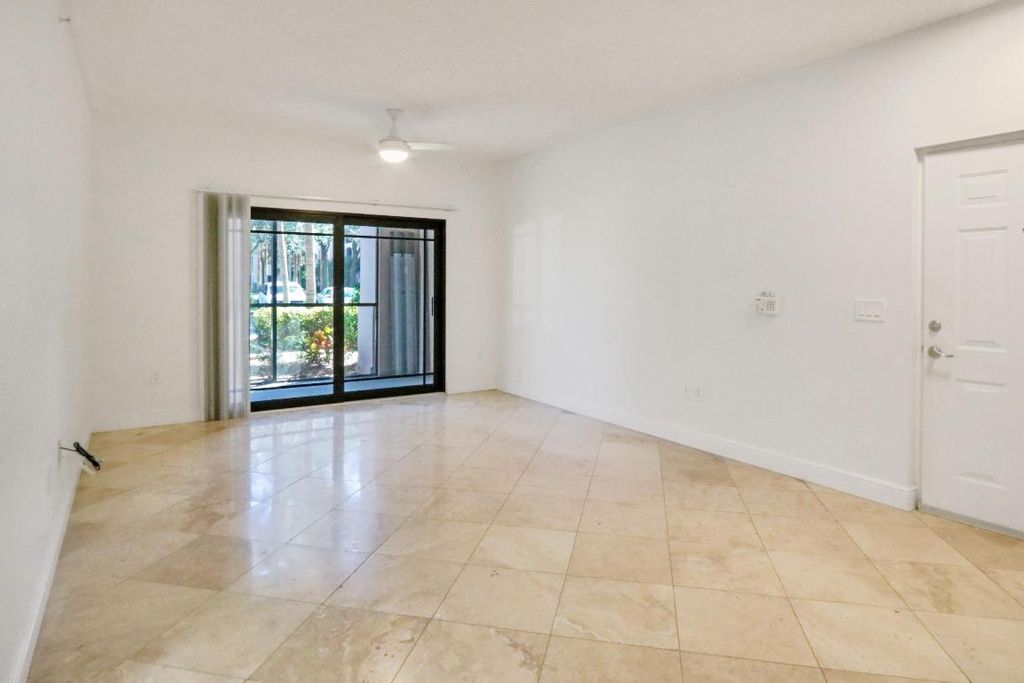 Photo of 3023 Alcazar Place #102, Palm Beach Gardens, FL 33410 (MLS # R10956421)