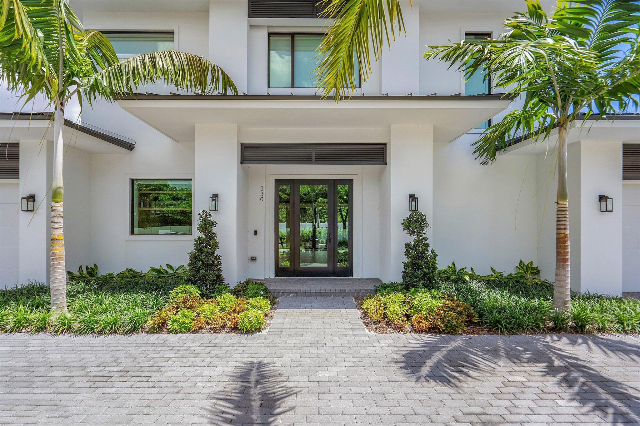 Welcome to 130 Pineapple Road, a coastal- modern retreat on a quiet, no-through street in the heart of Delray Beach. This newer Marc Julien home offers refined indoor-outdoor living just minutes from the beach & Atlantic Ave. The open-plan features a chef's kitchen w/Thermador appliances, floor-to-ceiling sliders, spacious great room & dining area. The first floor portrays a primary suite w/king bed & guest bedroom/den/office w/full-size sleeper sofa. Upstairs, a cheery loft leads to two bedrooms--one w/queen bed, the other w/Euro king or two twin beds--plus a shared full bath. Outside paradise awaits w/a private heated saltwater pool, covered loggia w/summer kitchen, outdoor living/dining, ping pong table & TV for game days or movie nights. Golf cart incl.! Furnished seasonal rental.
