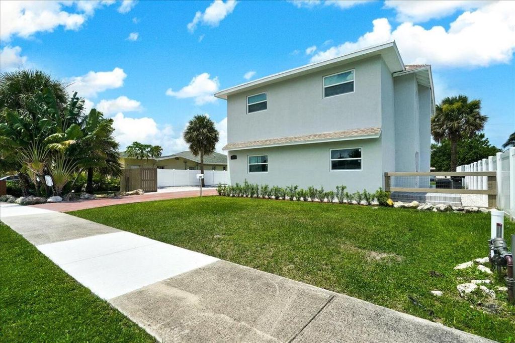 Photo of 305 Cypress Drive E #1,2,3,4,5, Lake Park, FL 33403 (MLS # R11126199)