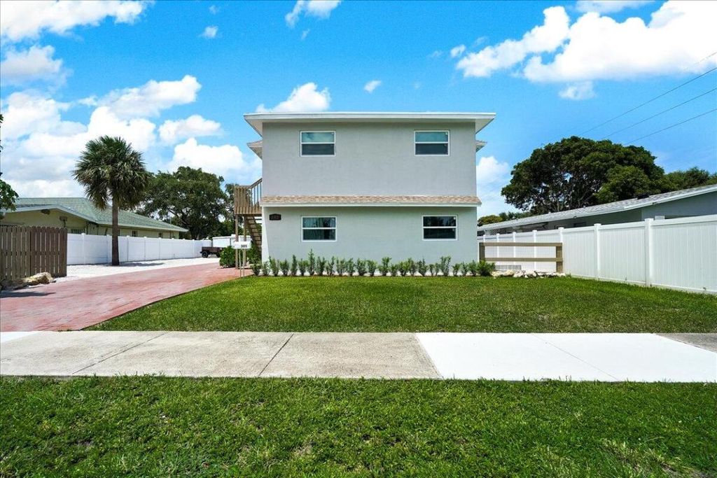 Photo of 305 Cypress Drive E #1,2,3,4,5, Lake Park, FL 33403 (MLS # R11126199)