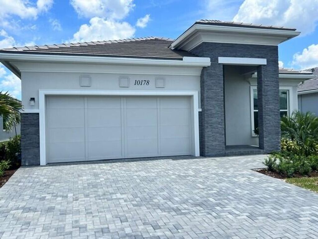 Photo of 10178 Timber Creek Way, Palm Beach Gardens, FL 33412 (MLS # B26026473)
